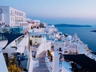 A vertical high angle shot of the white buildings in Santorini, Greece